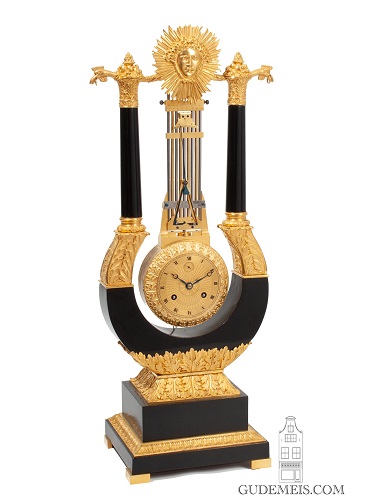 A French Charles X ormolu mounted lyre mantel clock with oscillating movement, circa 1830.